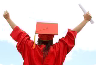 Graduate student celebrating her academic success.jpeg