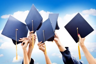 Unrecognizable group of people throwing graduations hats in the air.jpeg